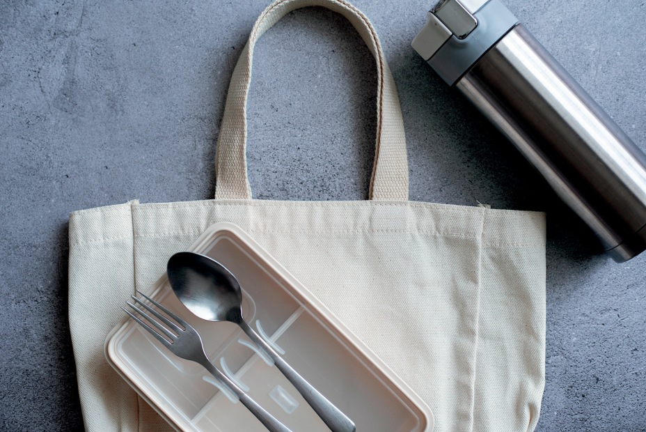 single-use products: reusable shopping bag, cloth napkin, eating utensils, and water bottle