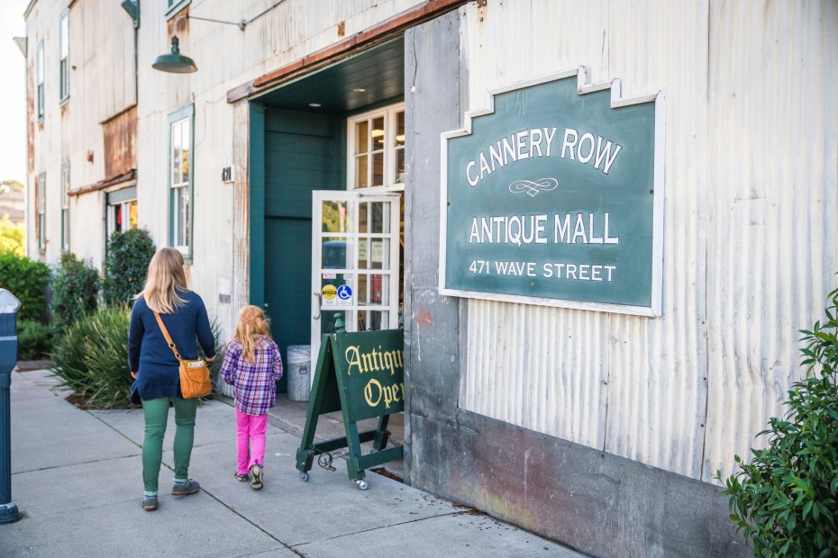 A mother and daughter walk into the Cannery Row Antique Mall in Monterey, California.