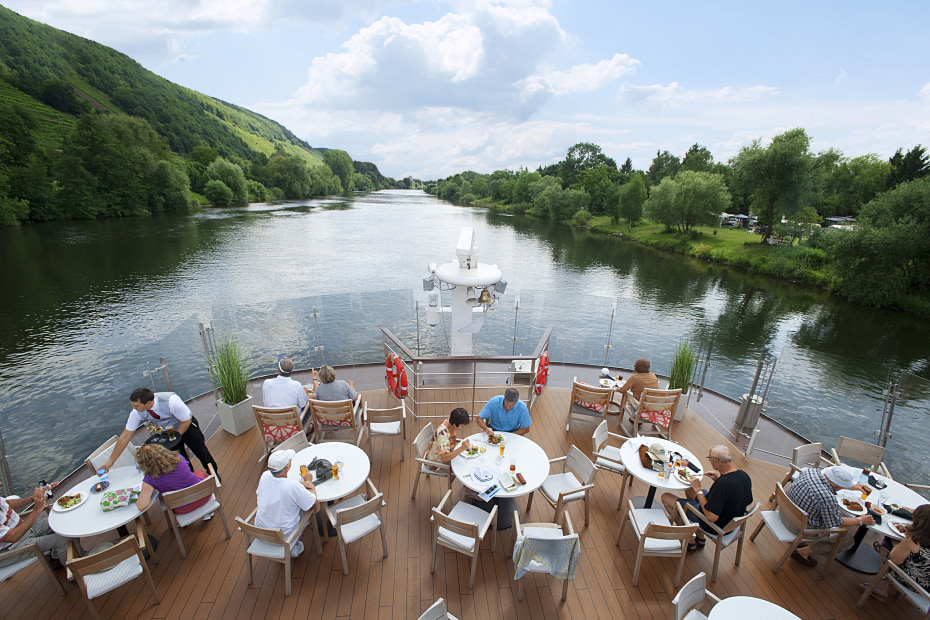Viking Danube River Cruise guests eating on the aquavit terrace.