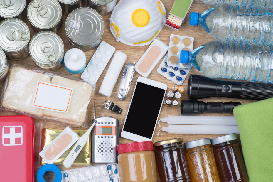 Disaster emergency kit supplies on a table.