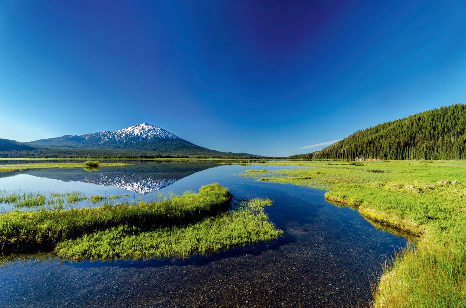 Oregon's Mount Bachelor self reflects in Sparks Lake