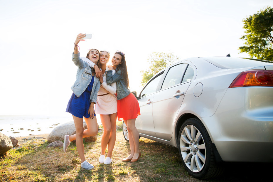 Teens take a photo at an overlook.