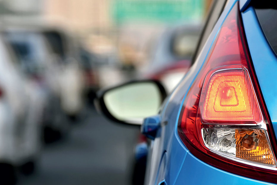 detail of driver's side rear tail light towards side view mirror