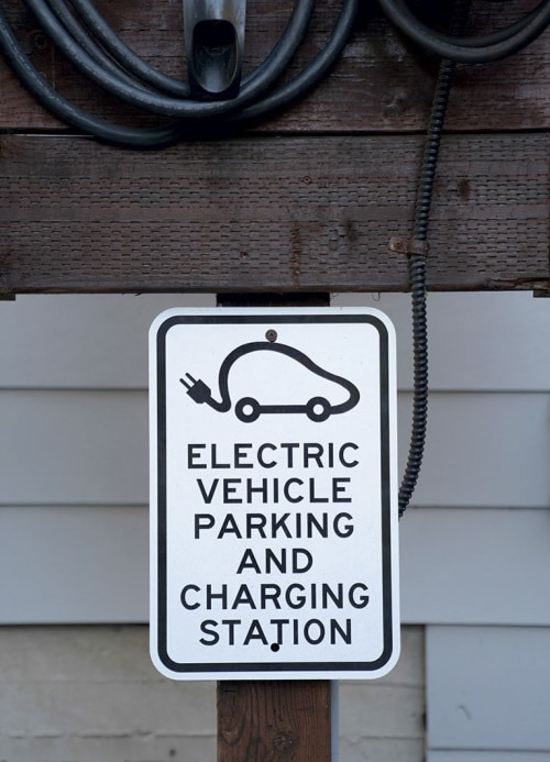 Electric vehicle (EV) parking and charging station sign