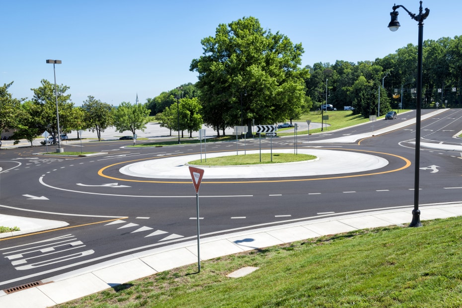 A road with a roundabout in the middle.