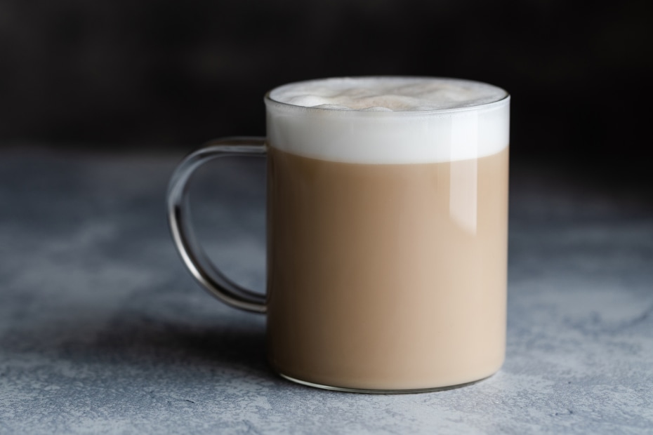 Toasted green tea latte in a glass mug