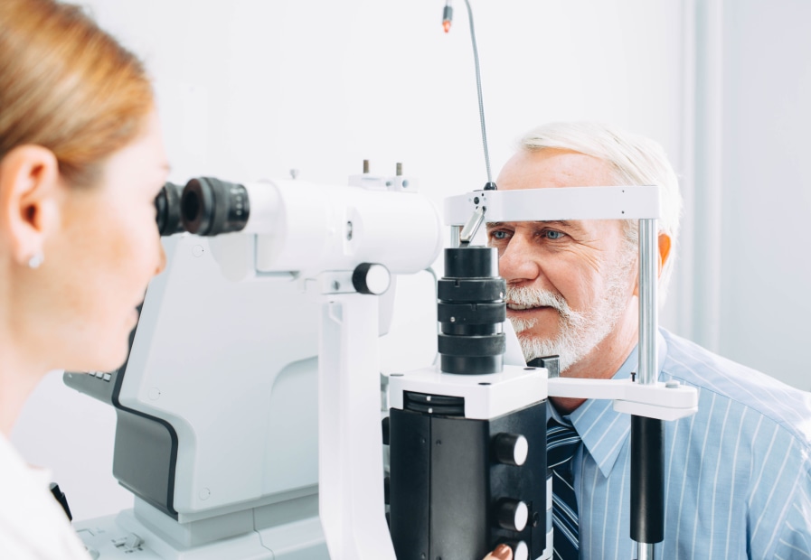 Senior man having an eye exam.