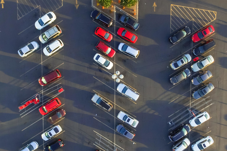 aerial view of cars in a parking lot.