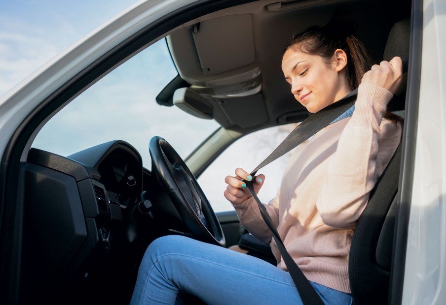 A teen driver buckles up.