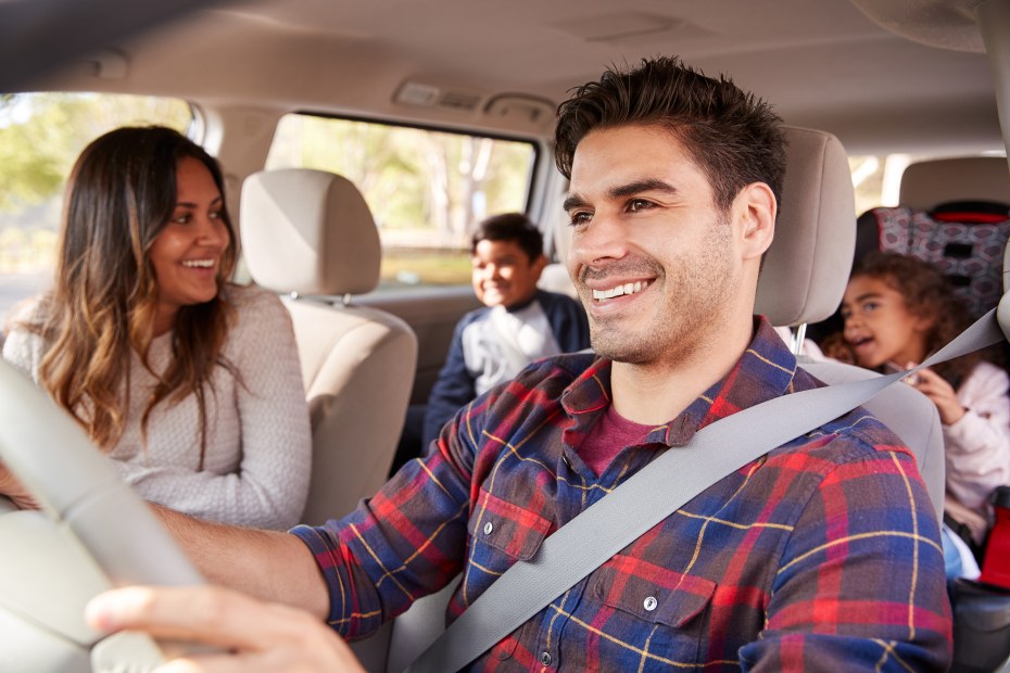 A family rides in a mini van.