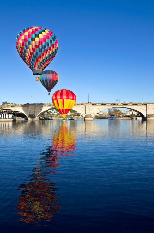 Hot air balloons rise over Lake Havasu.