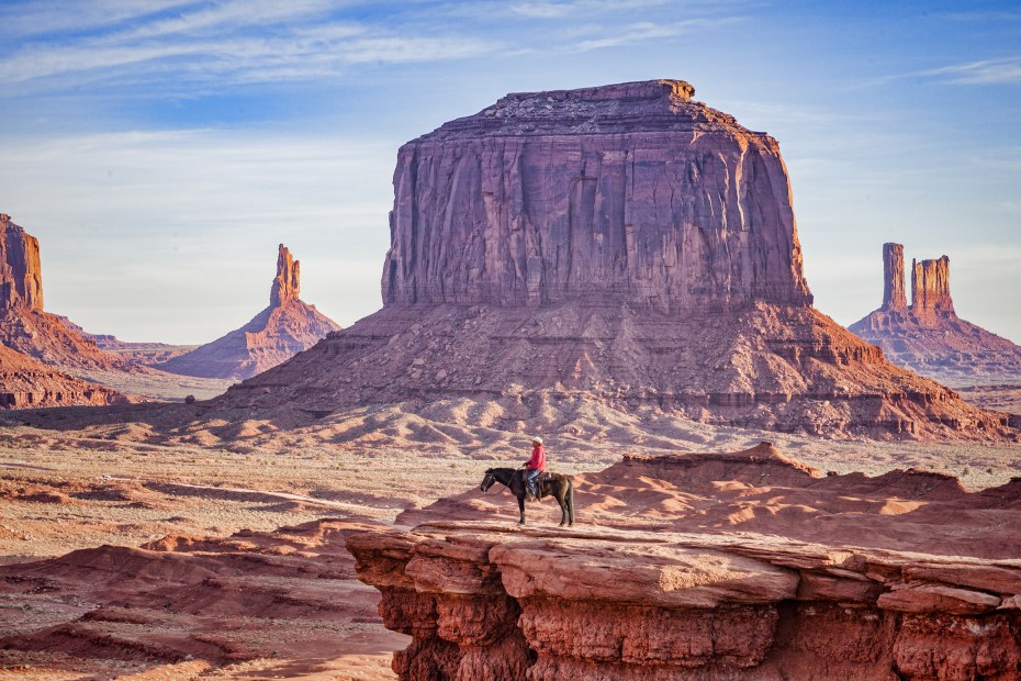 Navajo horseman at John Ford's Point in the Monument Valley Tribal Park, Arizona.