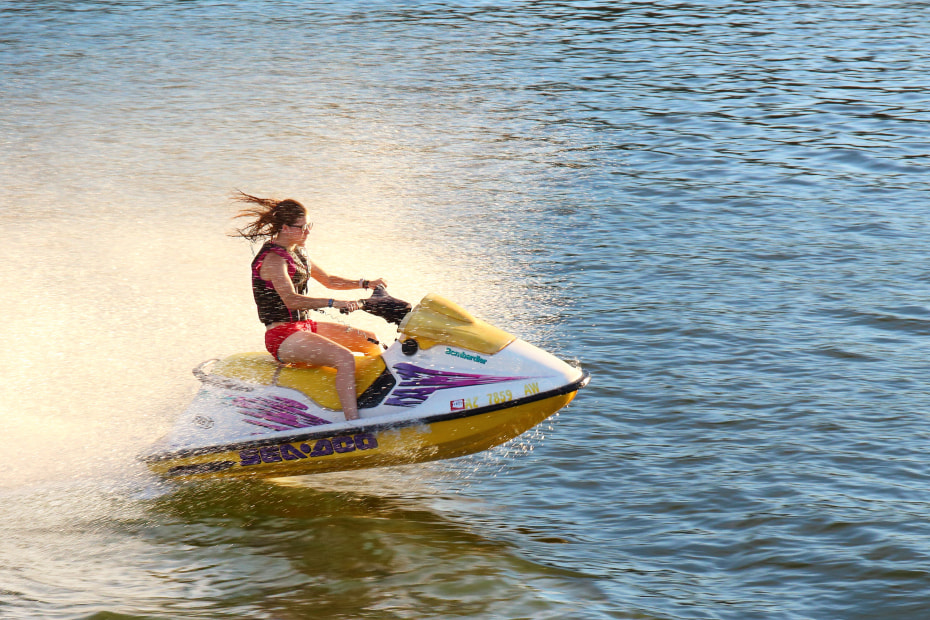 A woman rides a Sea-Doo.