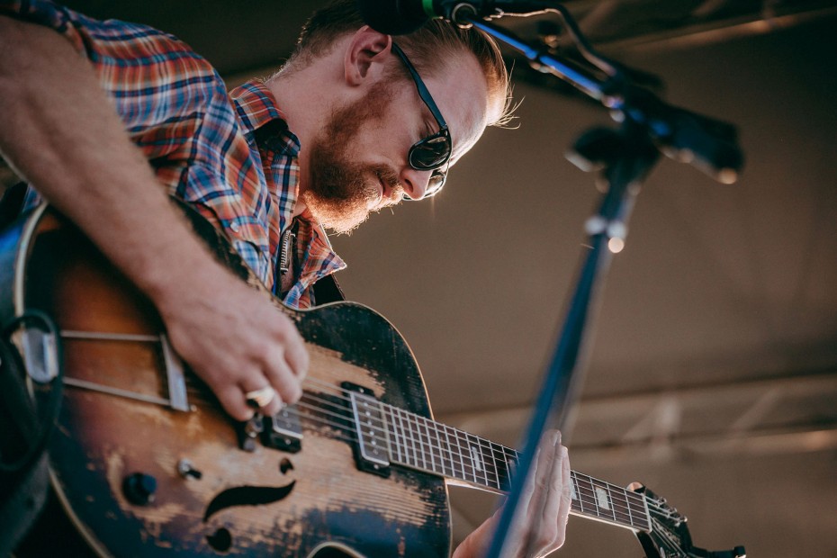 A musician plays a guitar at the annual Sawtooth Valley Gathering.