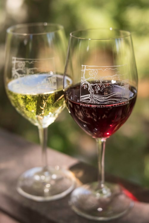 Wine glasses at the outdoor dining area at Page Springs Cellars.