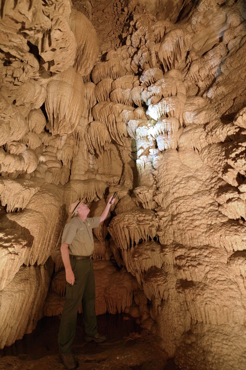 A National Park Service ranger leads a cave tour.