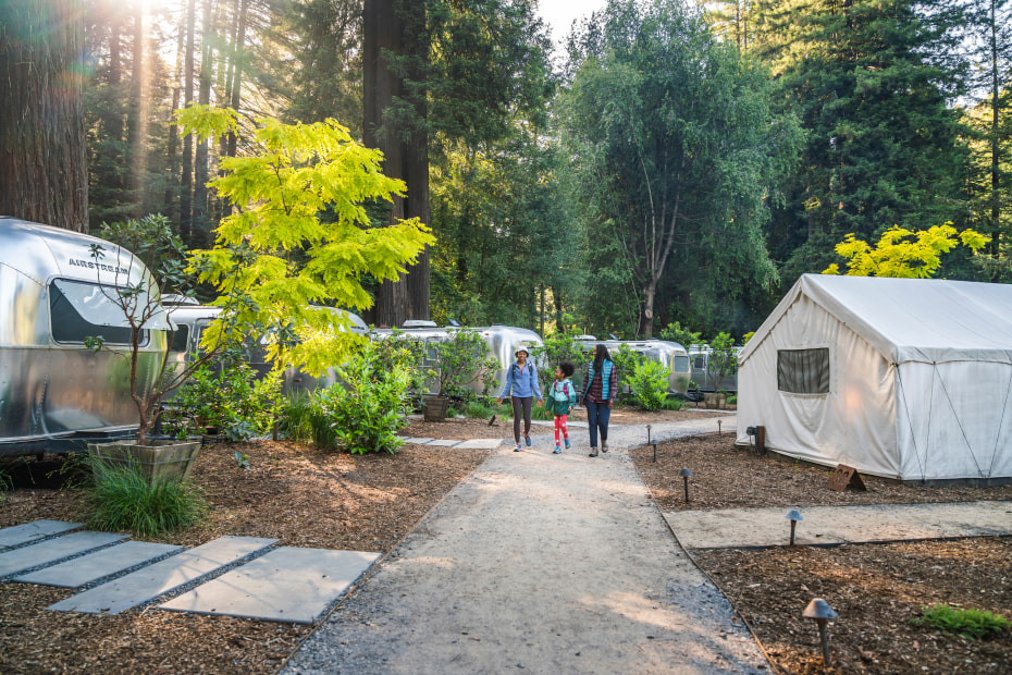 Guests walk thorugh the airstreams and tent cabins at Autocamp's Russian River resort.