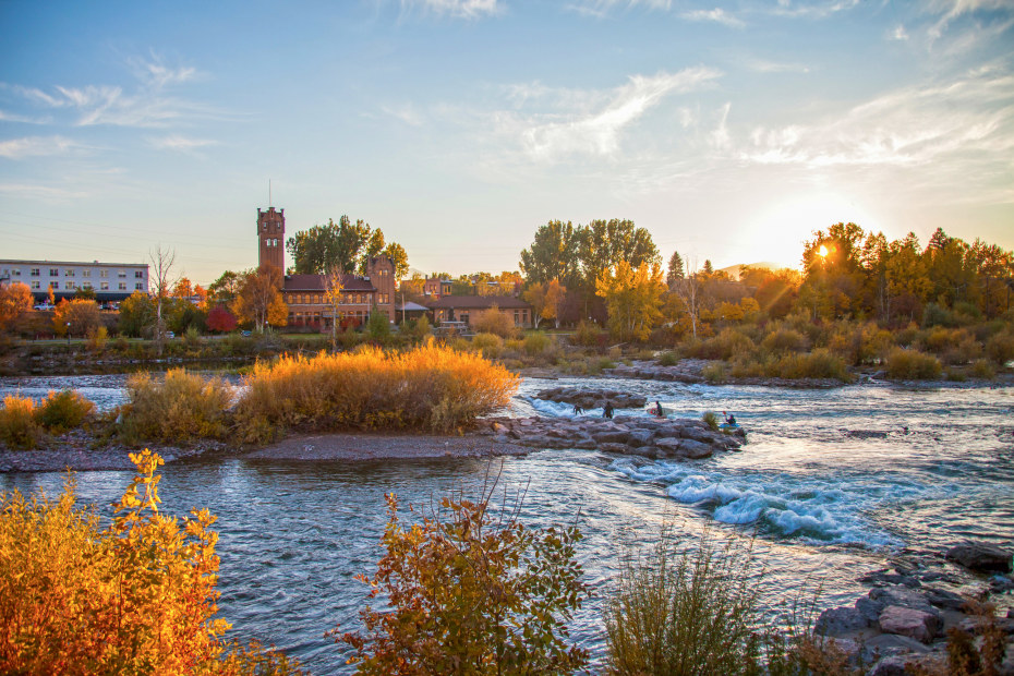 Students surf in a man-made wave in the Clark Fork River in Missoula, Montana.