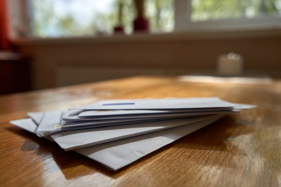 Mail left on the kitchen table.