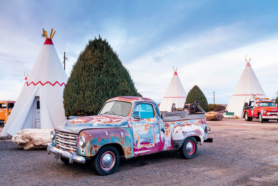 Vintage truck parked outside a teepee at the Wigwam Motel in Holbrook, Arizona.