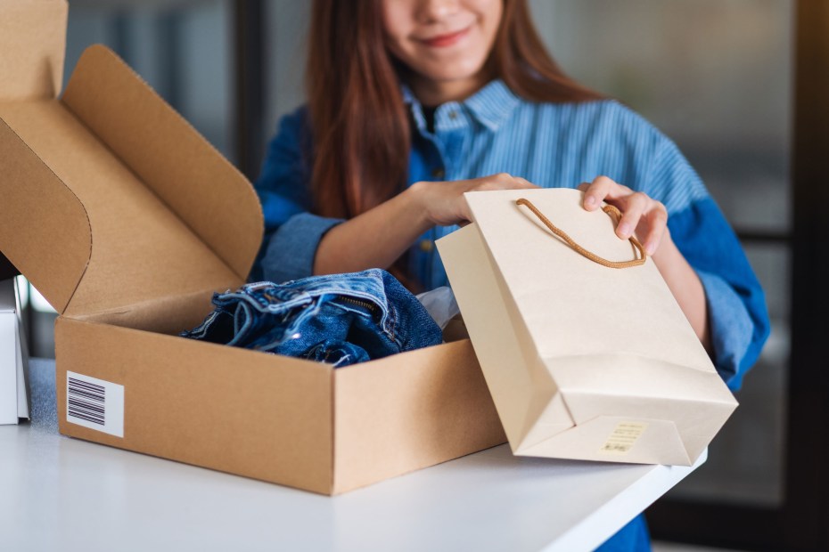 A woman opens an online purchase.