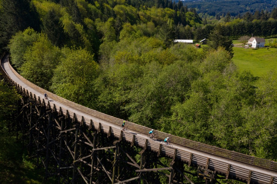 Cyclists ride on the Banks Vernonia Trail at the Buxton Trailhead near Banks, Willamette Valley, Oregon.