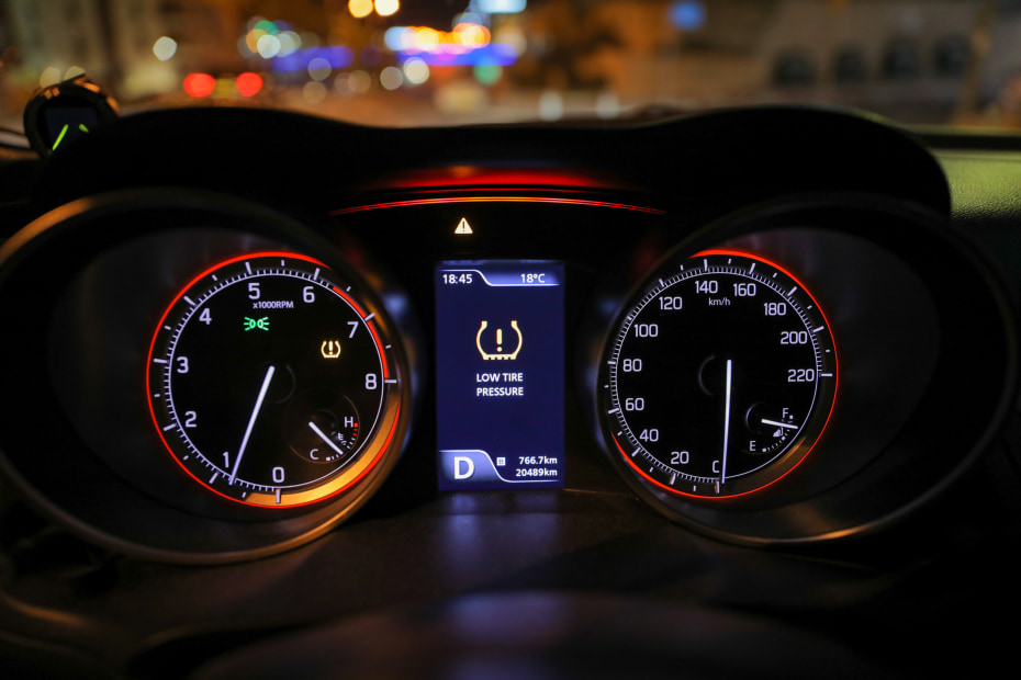 Tire pressure monitoring system light on a car's dashboard.