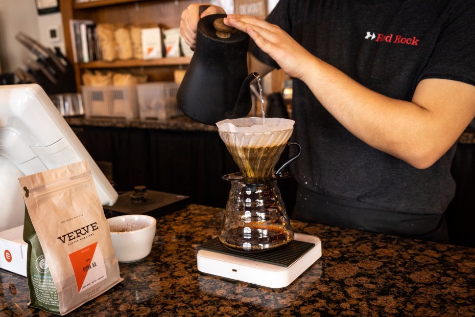 A barista makes a pour over coffee at Red Rock Cafe in Mountain View, California.