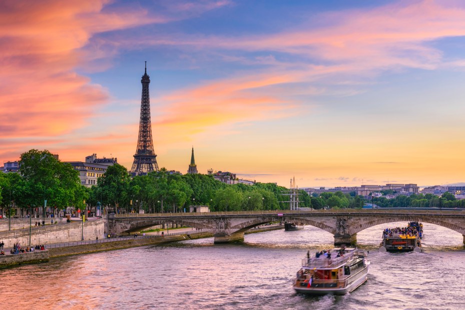 Sunset view of Eiffel Tower and Seine River in Paris, France.