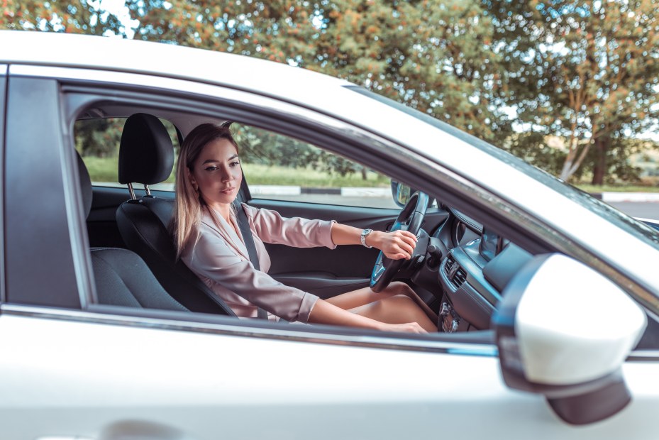 A woman looks over her shoulder before turning right.