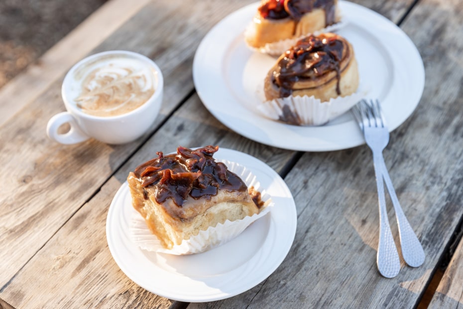 Fresh-made maple-bacon buns on a table at Alicia’s Sugar Shack in Sugar Pine, California.