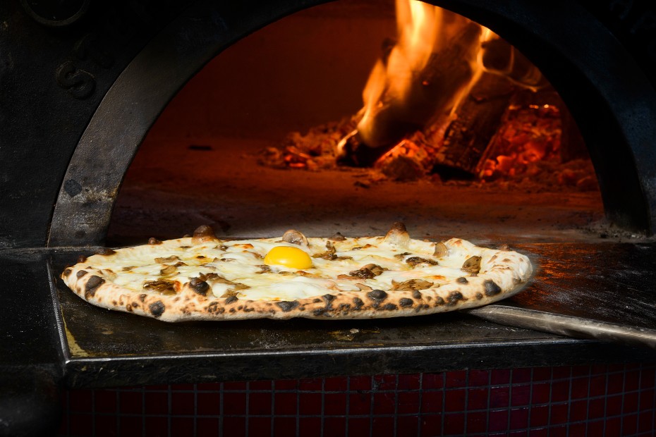 The Nomad pizza goes into the oven at SouthCreek Pizza Co.