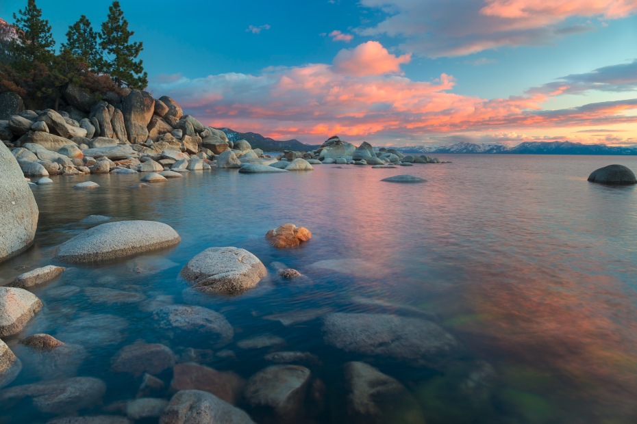 Pink and blue sunset reflects back on the water in North Lake Tahoe.