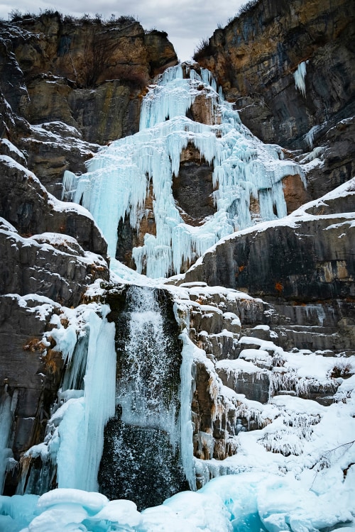 Stewart Falls frozen in winter.