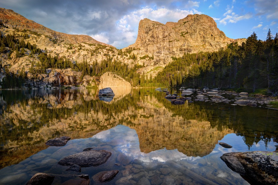 Mountains reflect in Cliff Lake in Bridger-Teton National Forest, Wyoming.