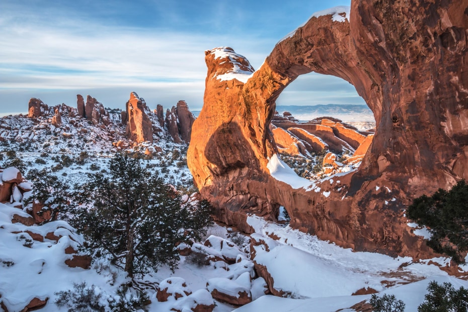 Double O Arch in Arches National Park, Utah covered in snow in winter, image