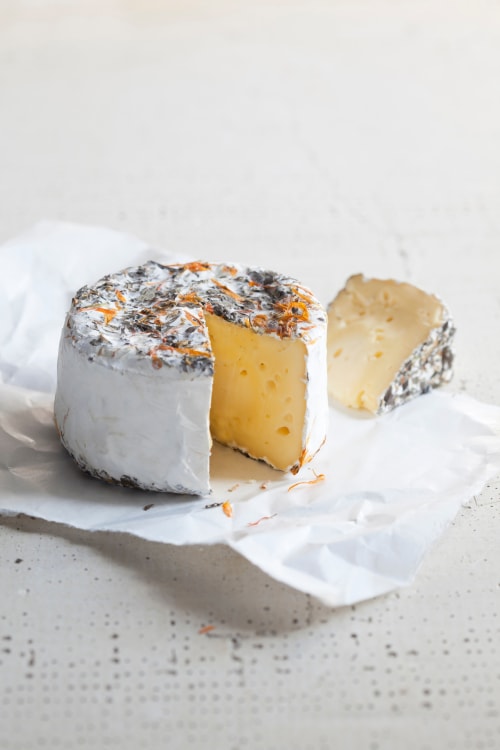 wheel of cowgirl creamery's pierce point cheese with a wedge removed