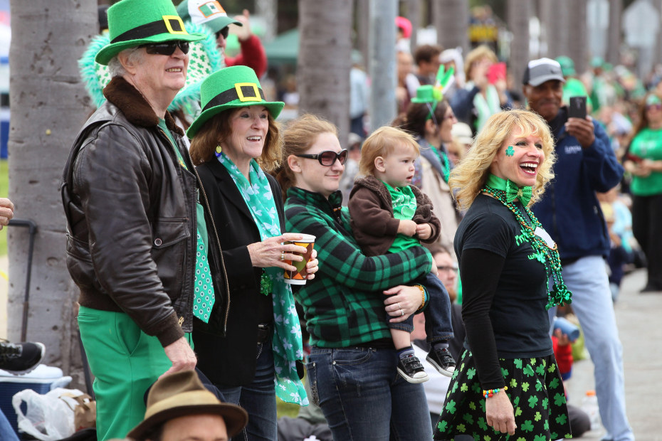 San Diego St. Patrick's Day Parade passes by a family on 6th. Avenue.