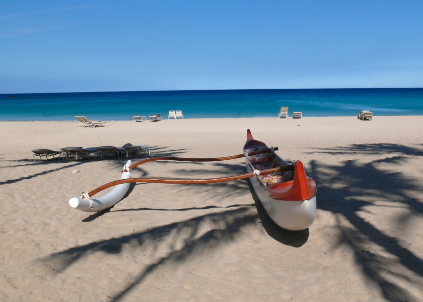 Red and white outrigger at Kauna'oa Beach, Hawaii, picture