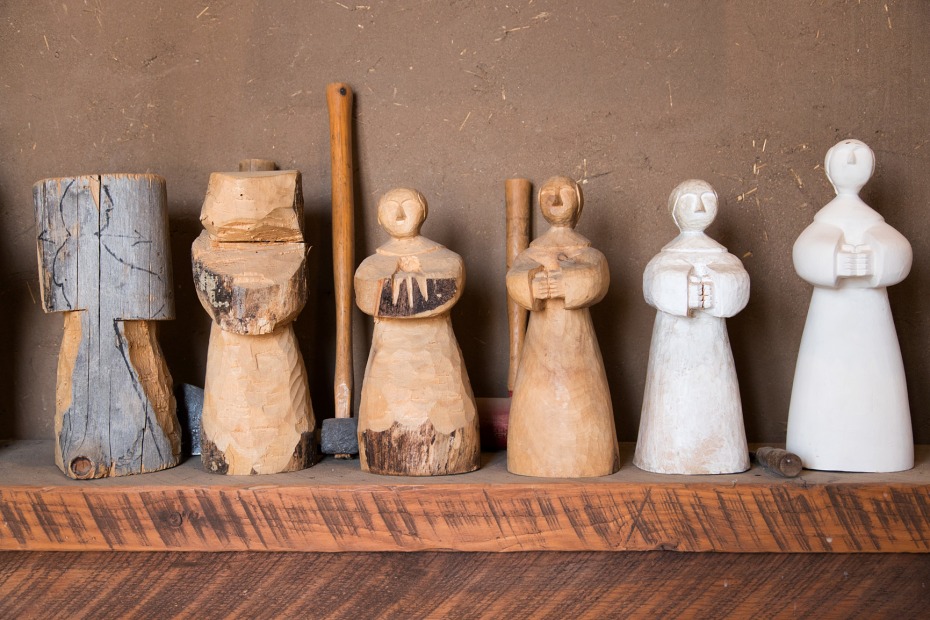 a set of carvings on a shelf at Oviedo Carvings & Bronze Gallery, in Chimayo, New Mexico