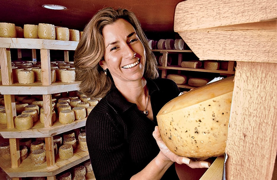 Ofri Barmor, owner of Carmelis Goat Cheese Artisan, holds wheel of goat Gruyère in the Carmelis curing room near Kelowna, B.C, Canada, picture