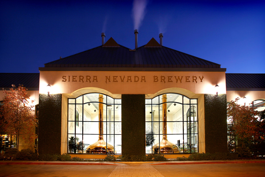 Sierra Nevada Taproom, Restaurant, and Brewery in Chico, CA lit up at night, image