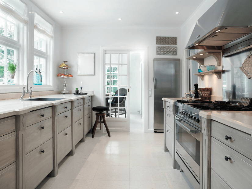 modern kitchen with white floors and gray cabinets