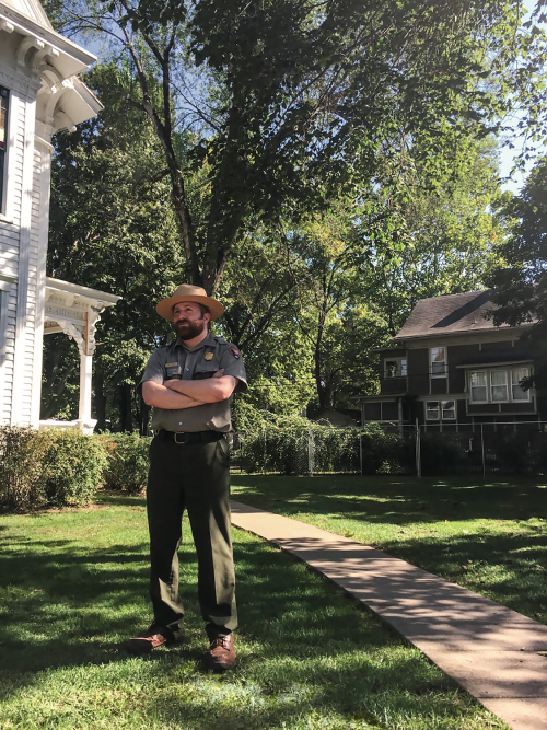 Matthew Turner, ranger and National Park Service's official social media presence, standing outside on a sunny day