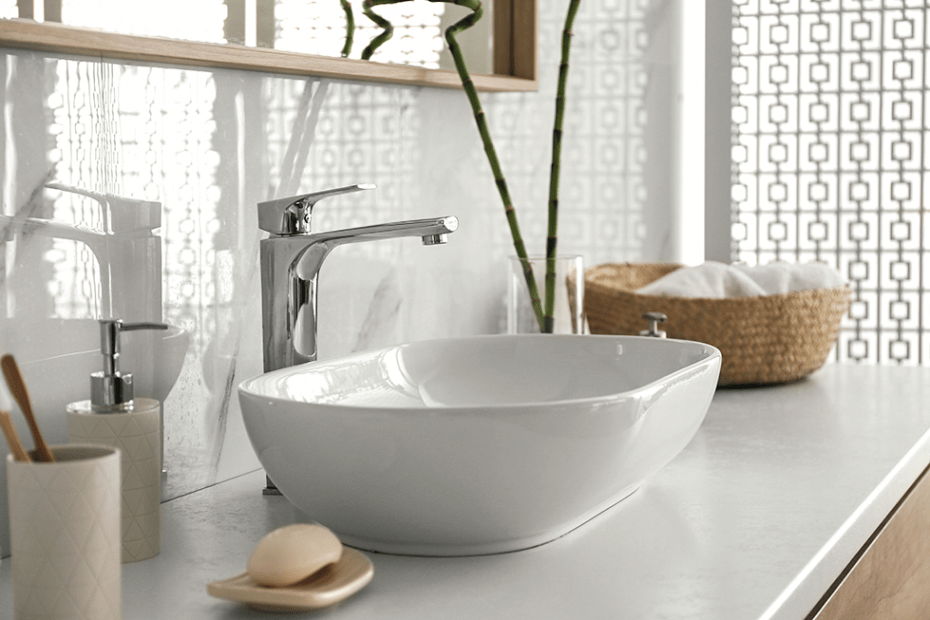 polished white oval bathroom sink on white vanity top