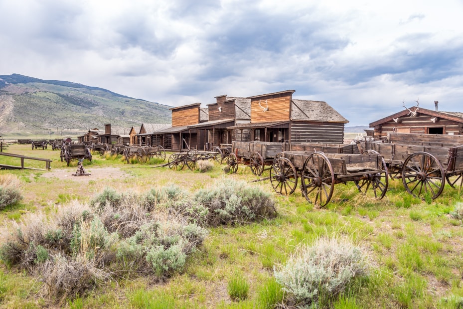 Wooden wagons and old wooden buildings in Cody, Wyoming.