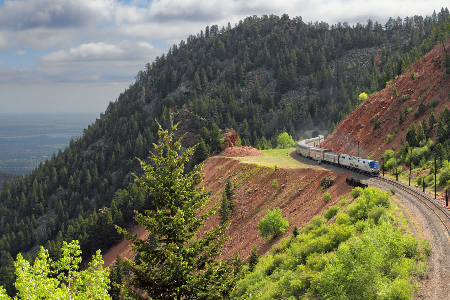 California Zephyr Amtrak train turns a corner in the mountains of Colorado.