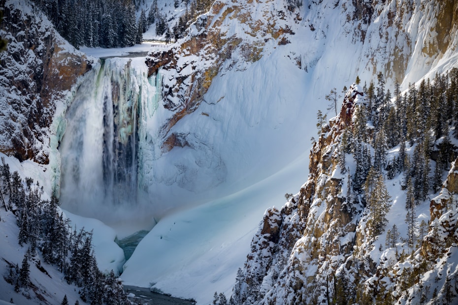 Partially frozen Upper Falls on the Yellowstone River in Yellowstone National Park.