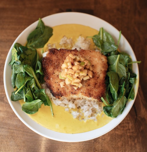 Panko crusted fresh Alaskan halibut with sesame-apple chutney and served with yellow curry, coconut jasmine rice, and fresh spinach.