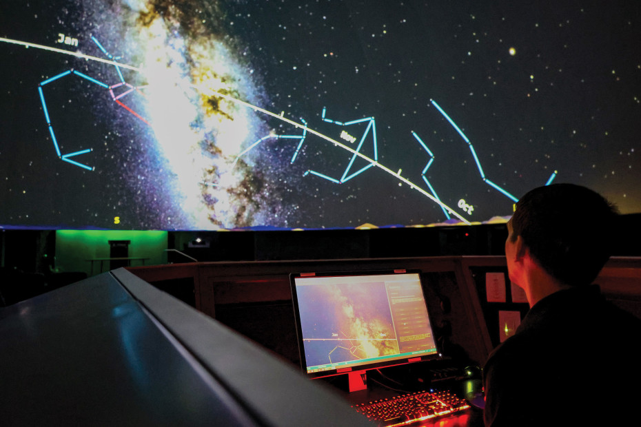 A technician runs a show inside Flandrau Science Center's planetarium.